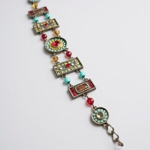 Southwest style metal bracelet. Rhinestones